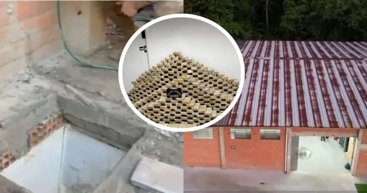 Bunker subterrâneo com tijolos expostos e pilhas de pacotes de cocaína em ambiente industrial com telhado de metal.