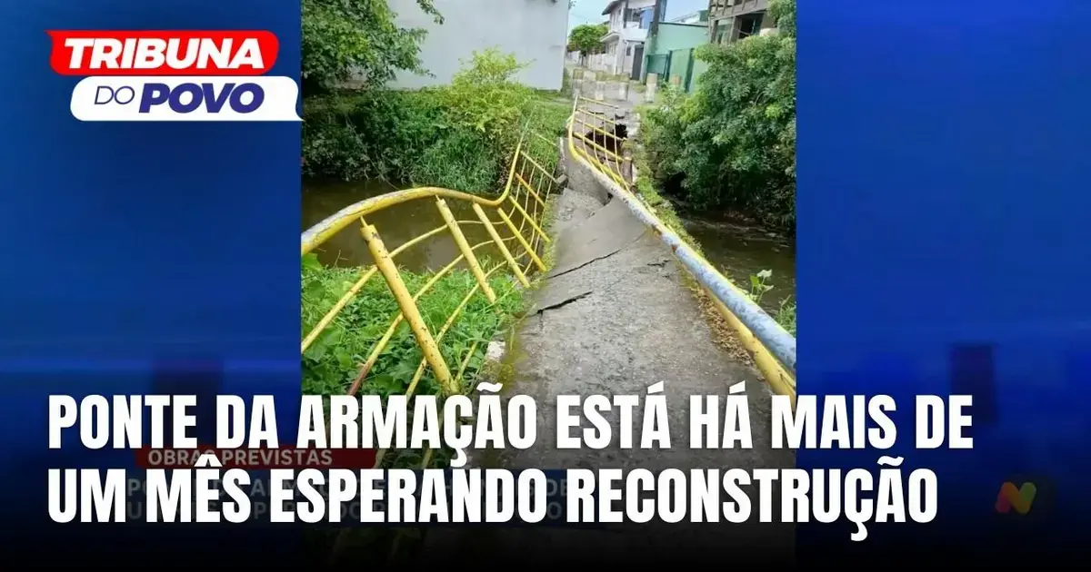 Ponte danificada no bairro Armação, com estrutura comprometida e vegetação ao redor, aguardando reconstrução.