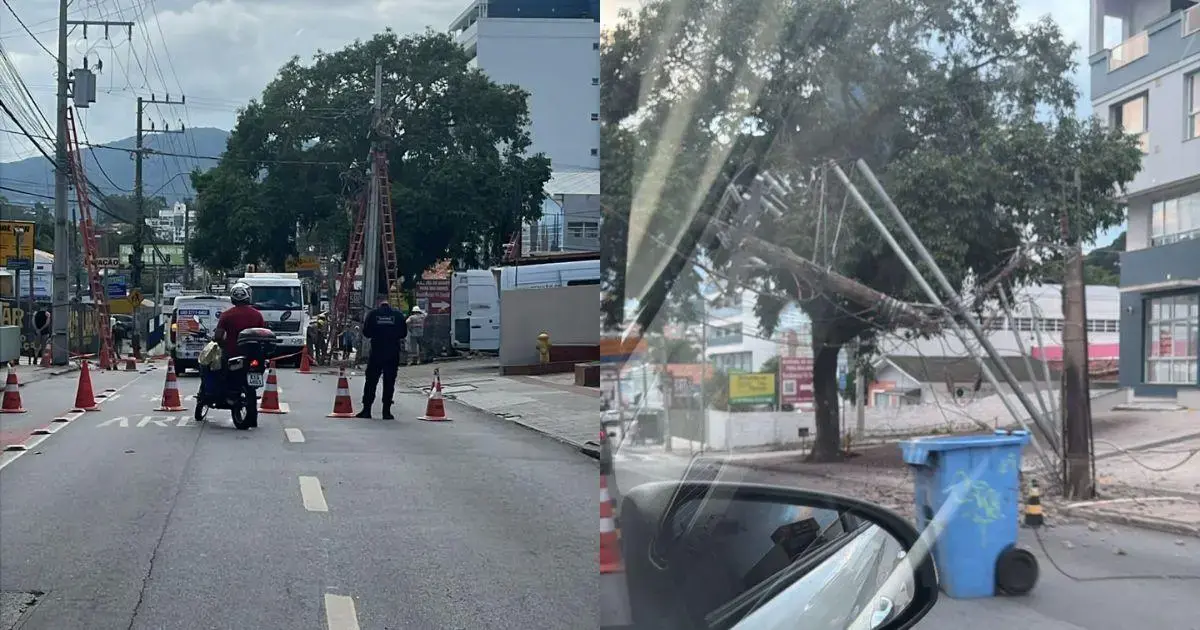 Caminhão e motocicleta em uma rua com cones de sinalização, equipe de trabalho ao fundo e postes de energia.