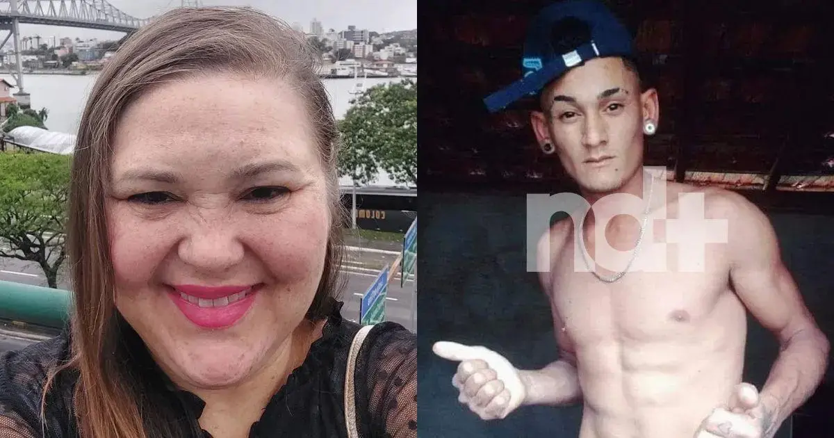 Selfie de mulher com cabelo liso e longo, sorrindo em frente a um cenário urbano; ao lado, homem sem camisa com boné, mostrando os músculos.